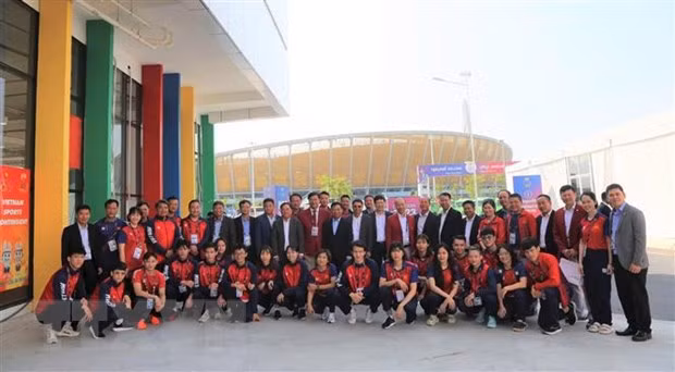Pesista vietnamita establece tres plusmarcas en SEA Games 32 ảnh 2
