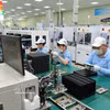 Línea de producción electrónica en la empresa SAMK WANG – Parque Industrial Quang Chau, provincia de Bac Ninh. (Foto: VNA)