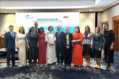 Los delegados en el evento se toman una foto de recuerdo. (Foto: VNA)