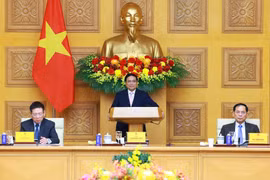 El primer ministro de Vietnam, Pham Minh Chinh, pronuncia un discurso en el coloquio (Fuente: VNA)